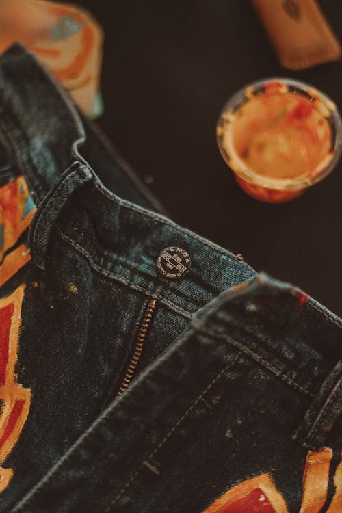 Painted Denim Pants in Close-Up Photography 