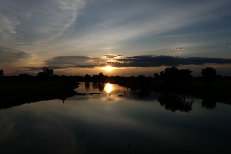 View Of A Lake At Sunset