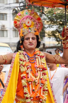 Vibrant celebration of Ratha Yatra festival with traditional costumes in Dhaka, Bangladesh.