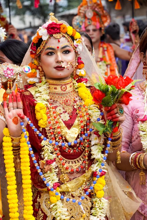 Free A vibrant depiction of a traditional Hindu festival with participants in elaborate costumes and decorations. Stock Photo