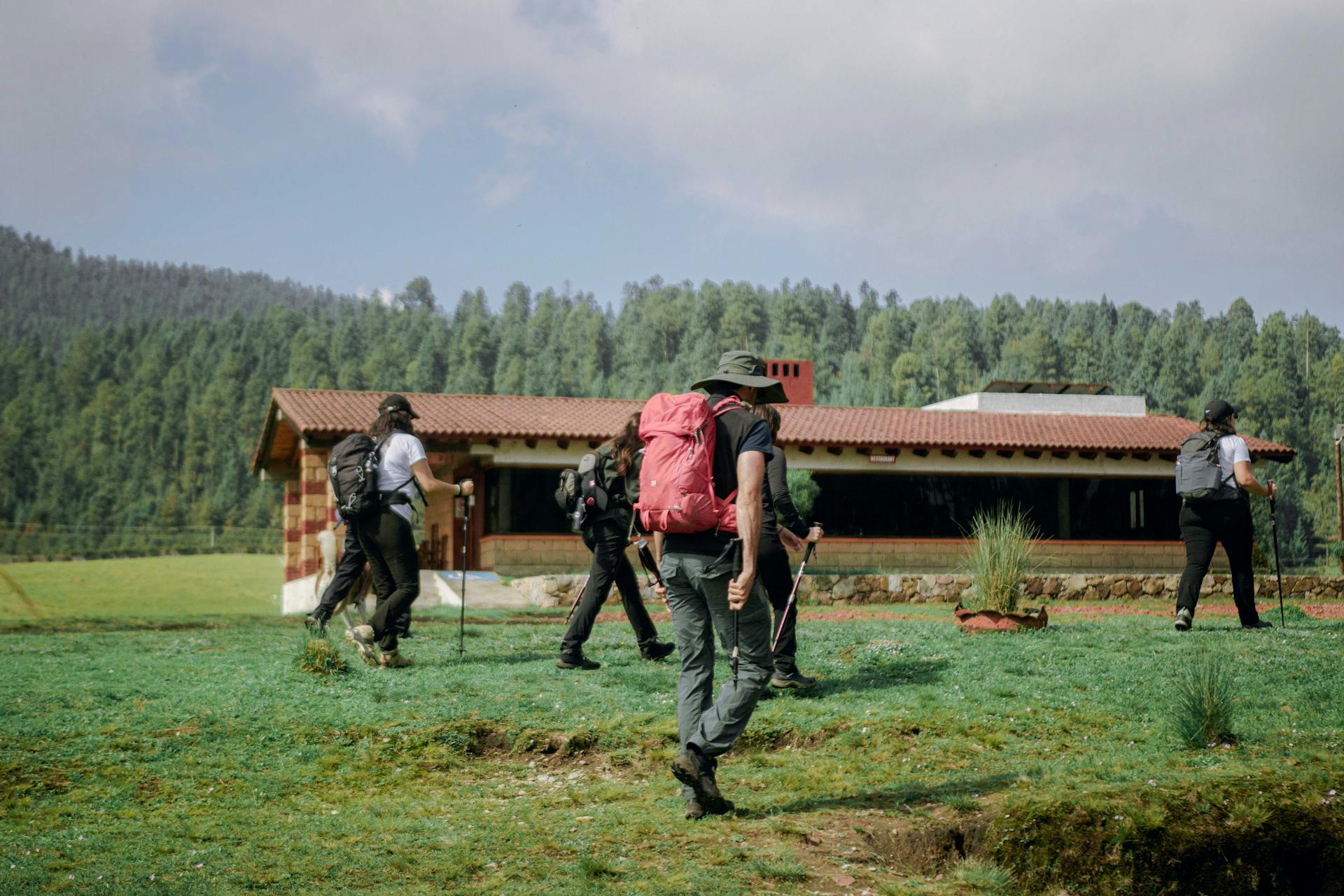 Hikers explore scenic trails near a cabin in Valle de Bravo, Mexico.