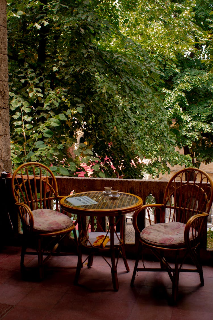 Rattan Table And Chairs On A Balcony