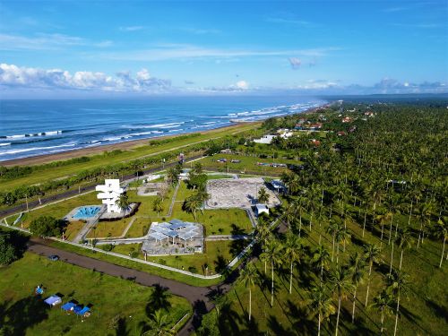 Free Stunning aerial view of Pangandaran Beach resort with lush greenery and ocean waves in West Java, Indonesia. Stock Photo