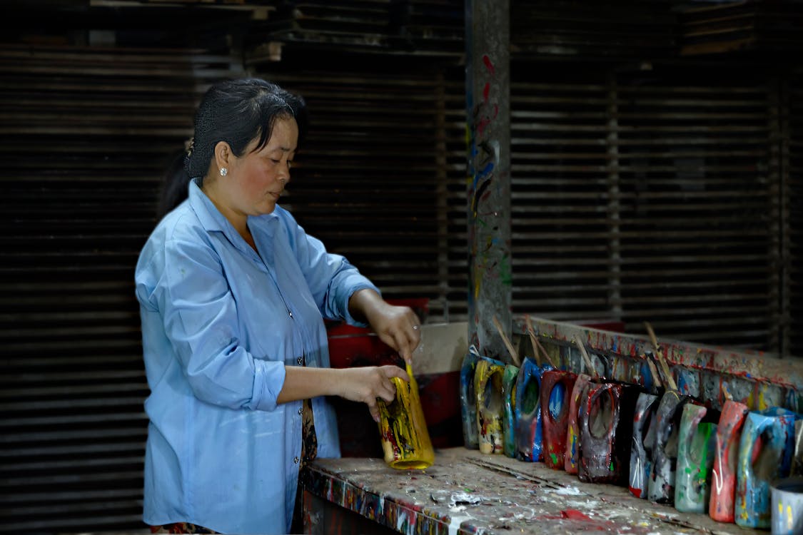 Woman Standing and Painting