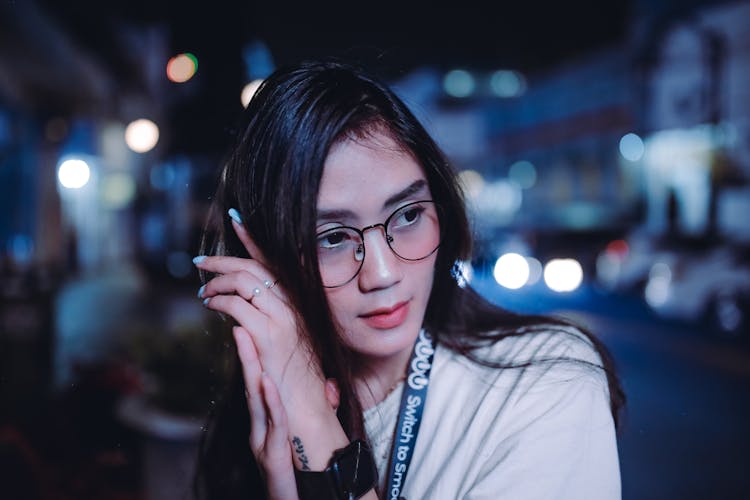 Woman Wearing A White Shirt And Eyeglasses