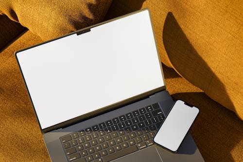 Smartphone and a Laptop With Blank Screens 