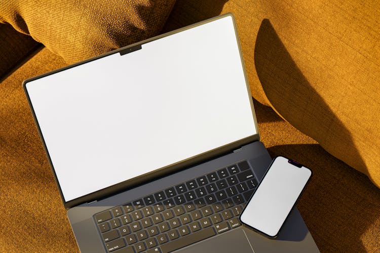 Smartphone And A Laptop With Blank Screens 