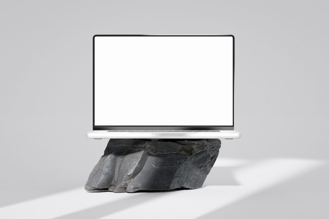 A Laptop on a Rock · Free Stock Photo