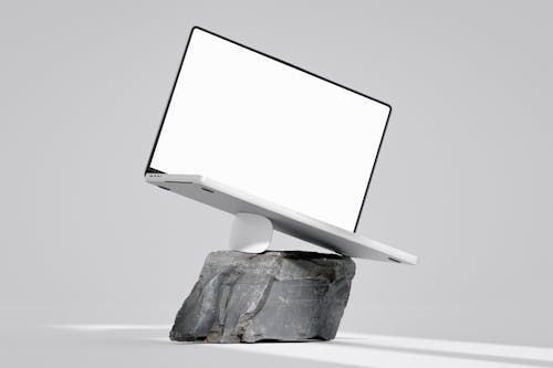 Tilt Laptop on Mouse on Stone Block