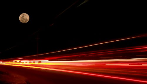 Moon over long exposure light trails