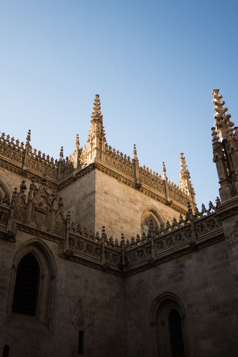 Ornate Gothic pinnacles and walls of the Royal Chapel of Granada