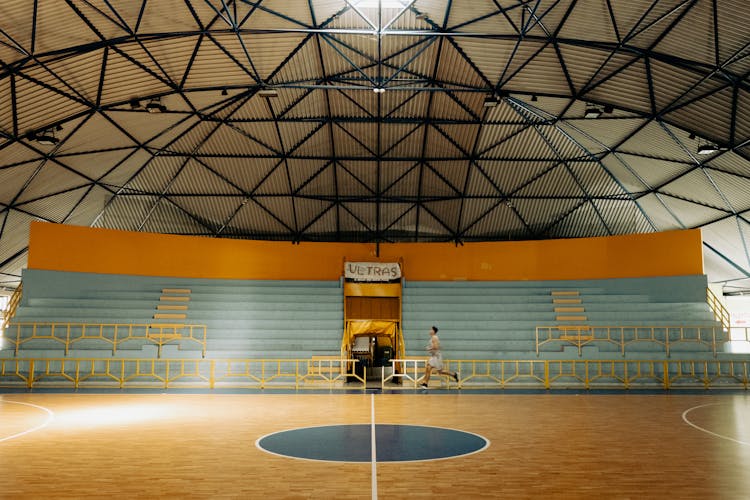 Man Running On Basketball Court