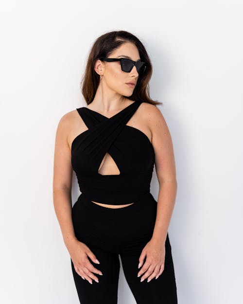 Free Portrait of a Woman in Sunglasses and Black Clothing Stock Photo