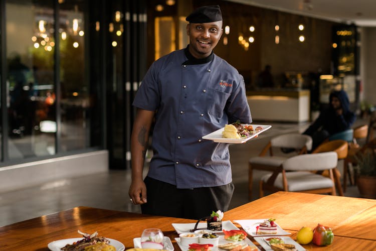 Man Holding A Plate Of Food