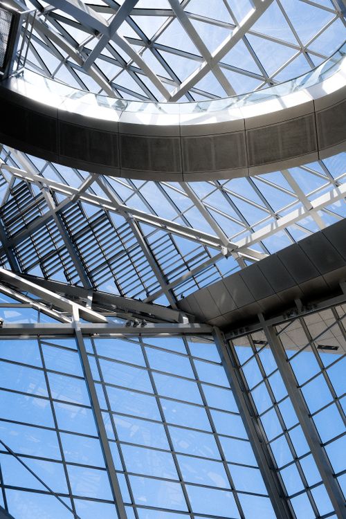 Free A stunning glass ceiling showcasing modern architectural design, allowing natural light to illuminate the space. Stock Photo