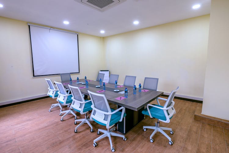 Empty Conference Room With Table And Chairs