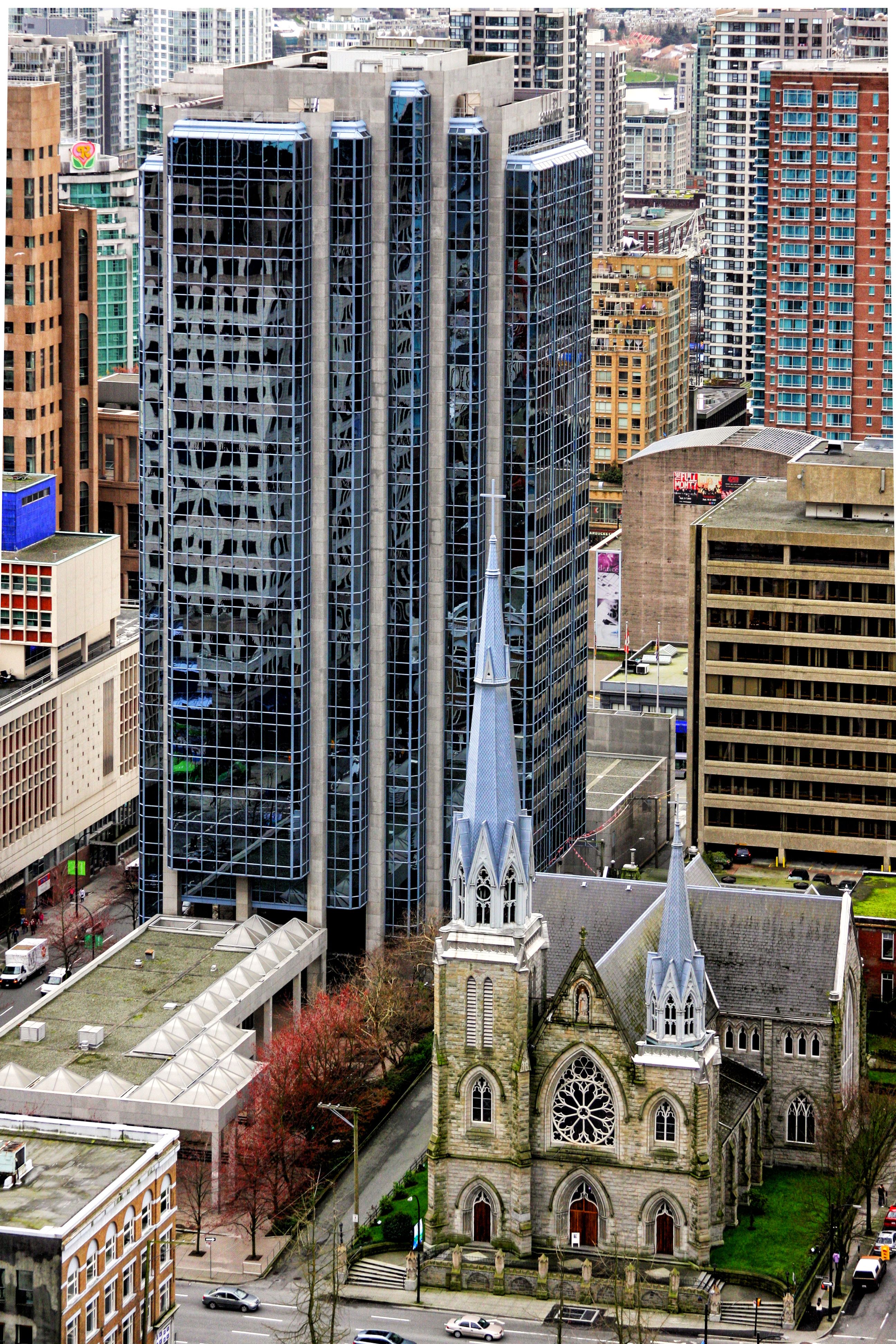 Stunning aerial view of cathedral amid Vancouver's urban skyline.