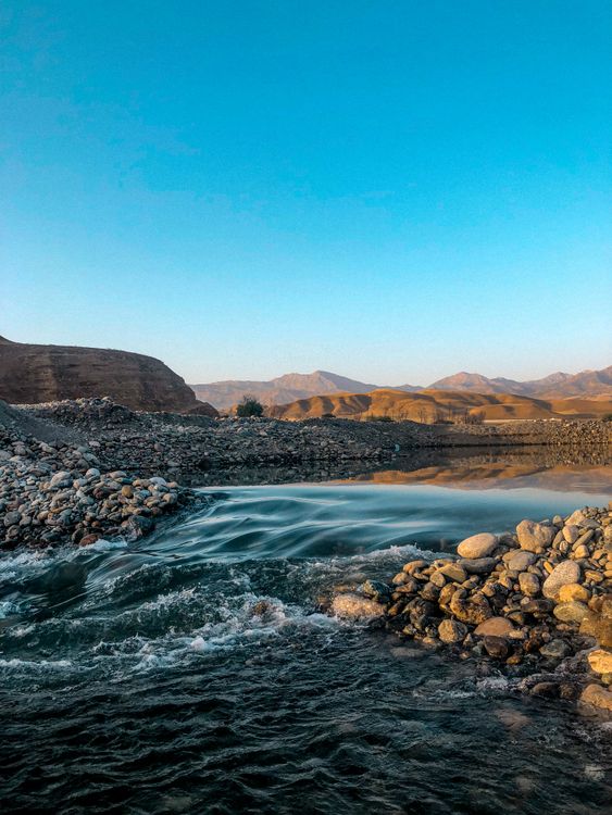 Rocky Landscape with a Flowing River · Free Stock Photo