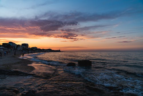 Foto profissional grátis de água, alvorecer, beira-mar