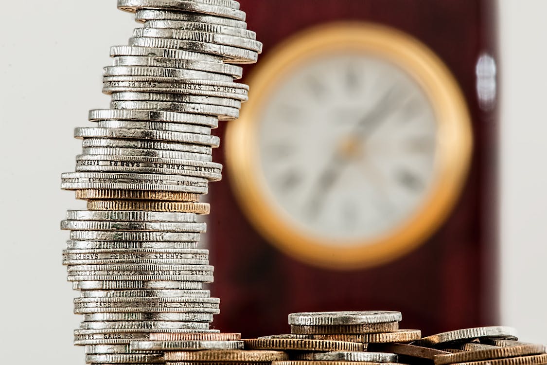 Free Selective Focus Photo of Stacked Coins Stock Photo