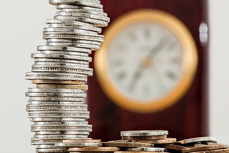 Selective Focus Photo Of Stacked Coins