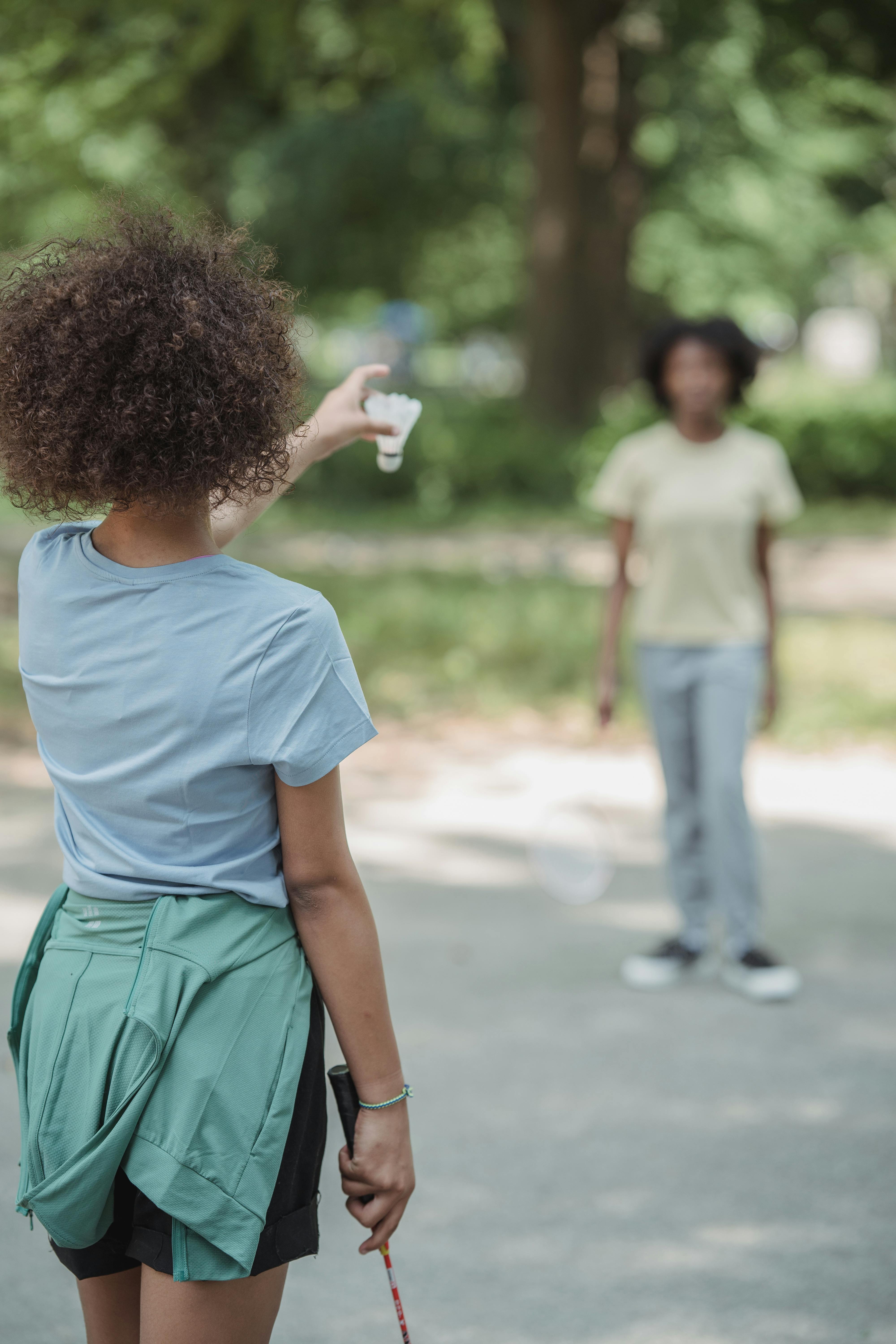 two girls playing badminton