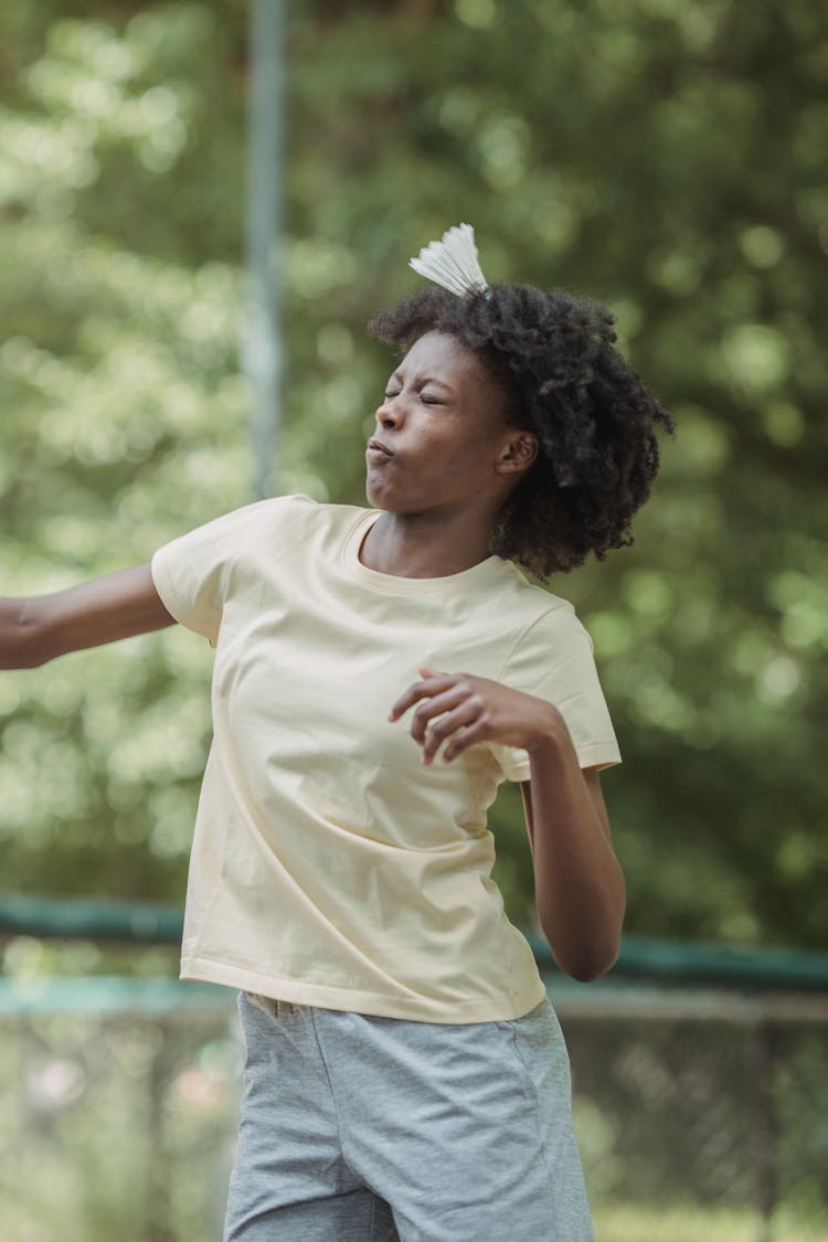 Girl Getting Hit With A Badminton Shuttlecock