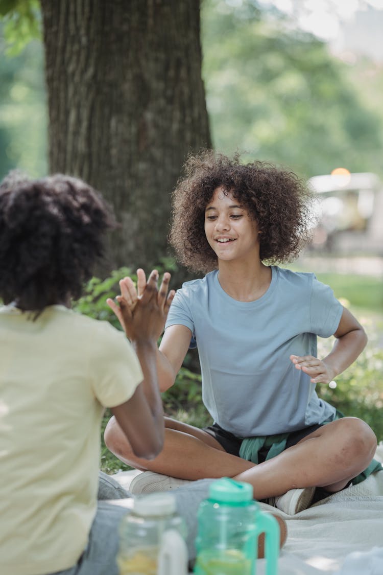 Girls Clapping Hands While Playing A Game