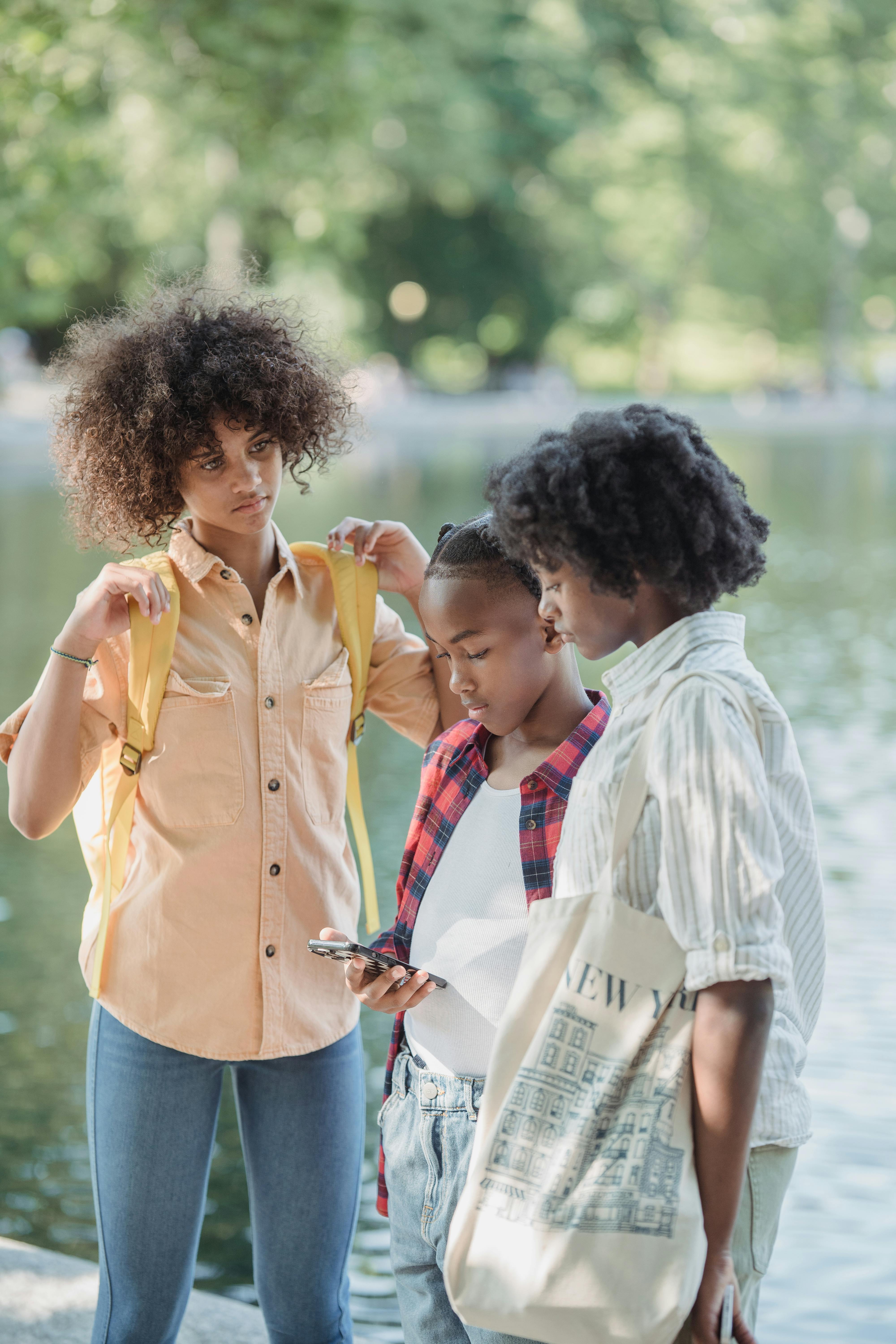 Kids Sitting on Steps in a Park Free Stock Photo