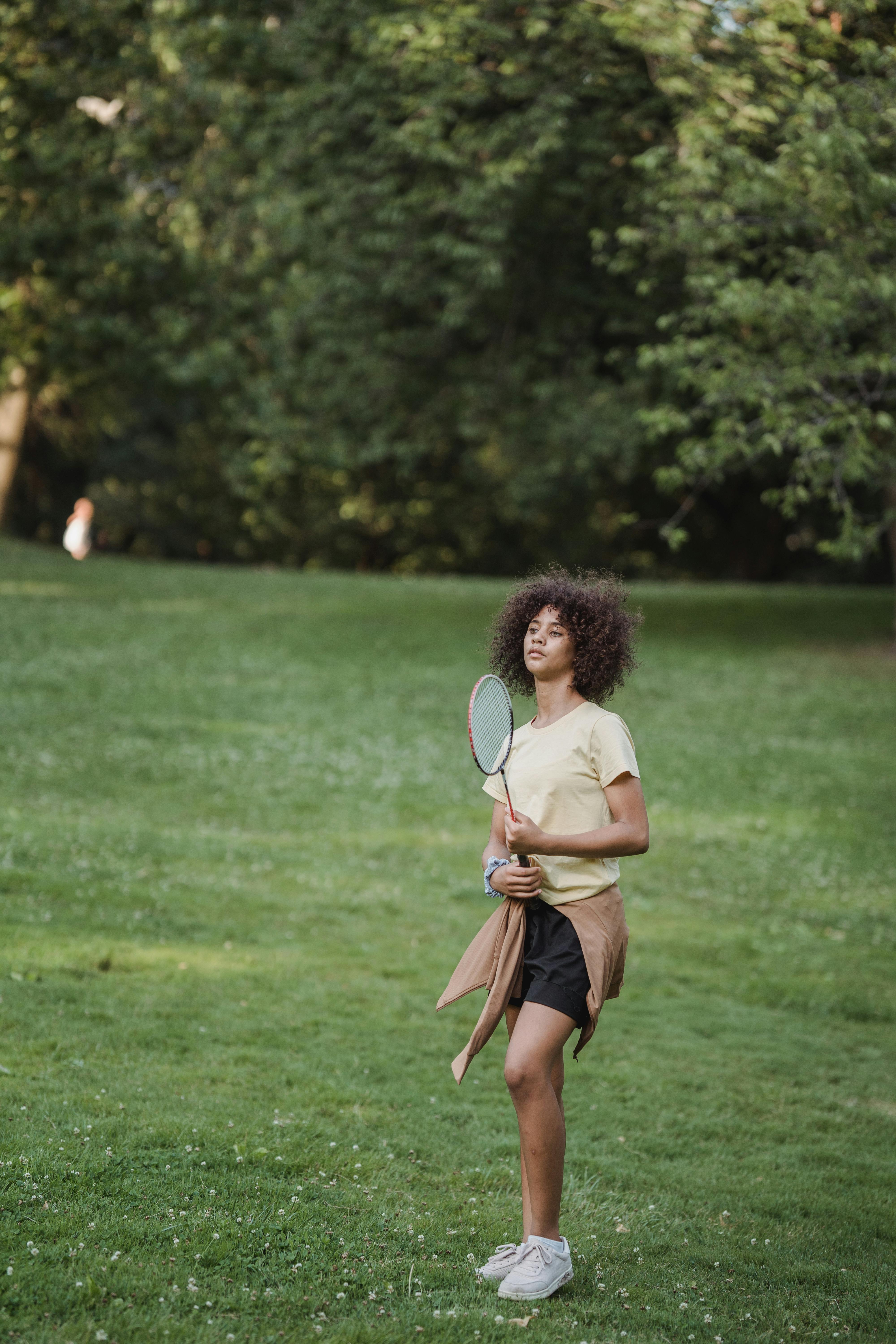 teenage girl with a badminton racket