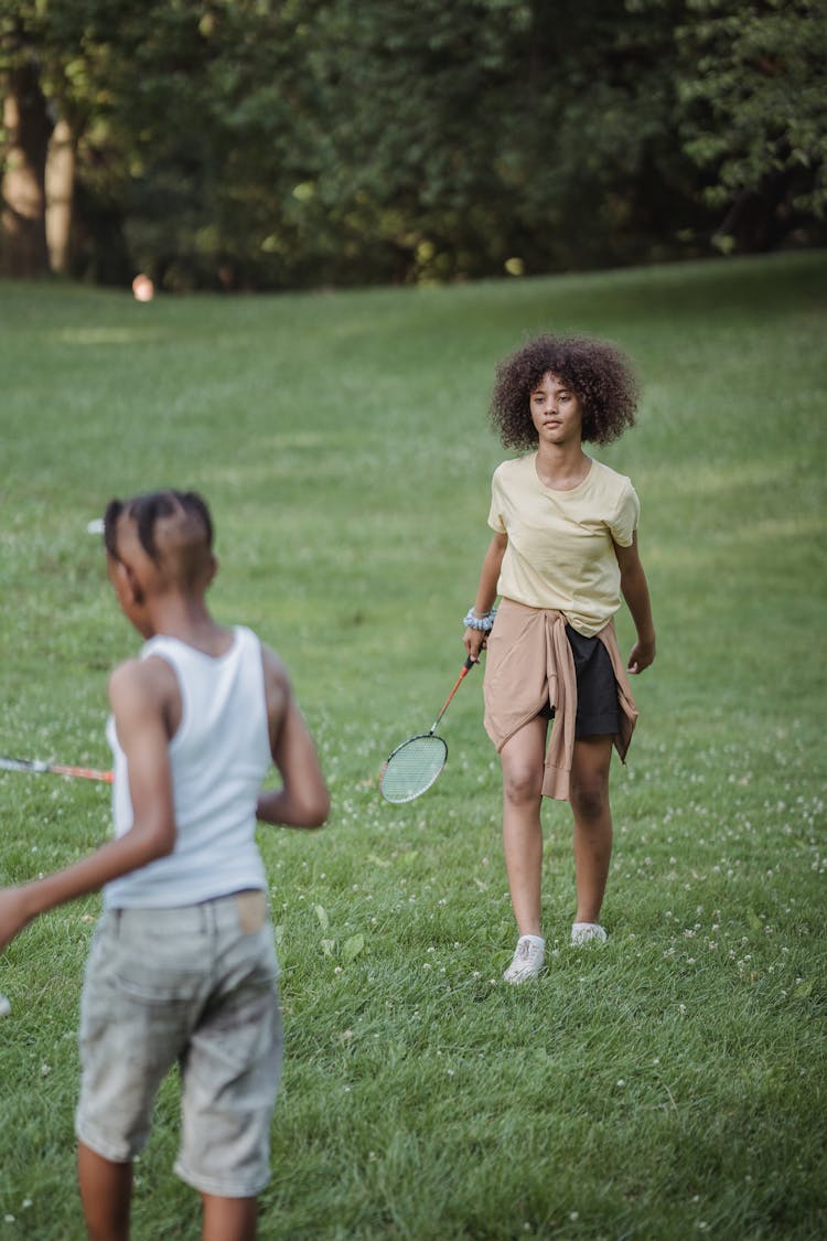 Children Playing Badminton In Park