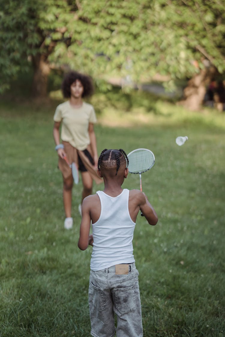 Children Playing Badminton In Park