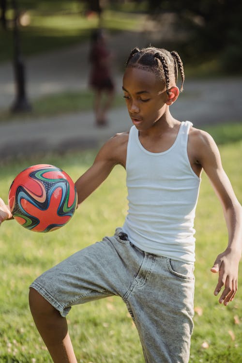 Boy Playing with a Football 