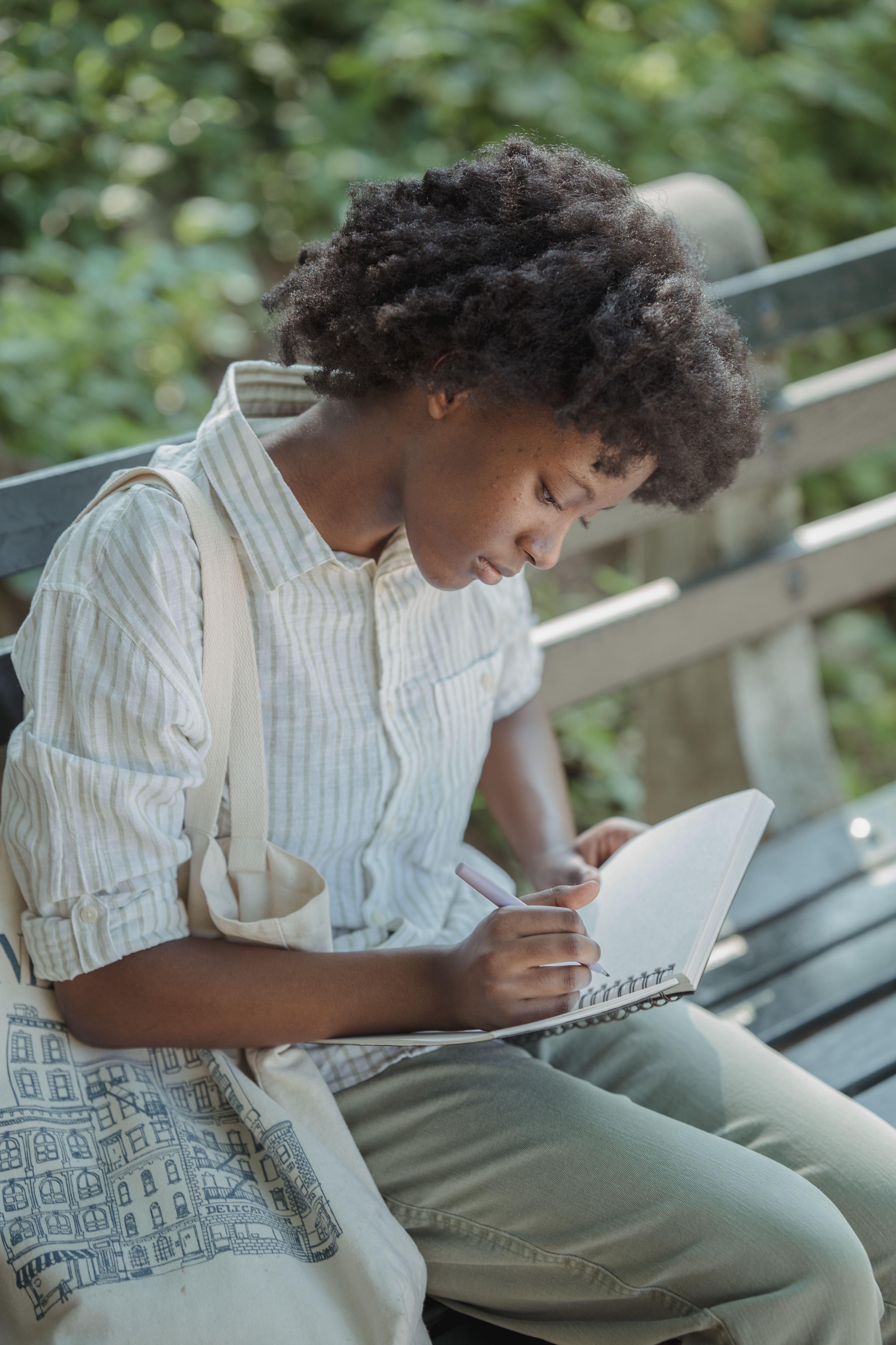 Teenage Girl Sitting on the Bench in the Park and Making Notes · Free ...