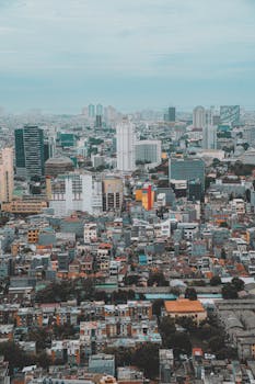 Elevated city view showcasing Jakarta's dense urban skyline and architecture.