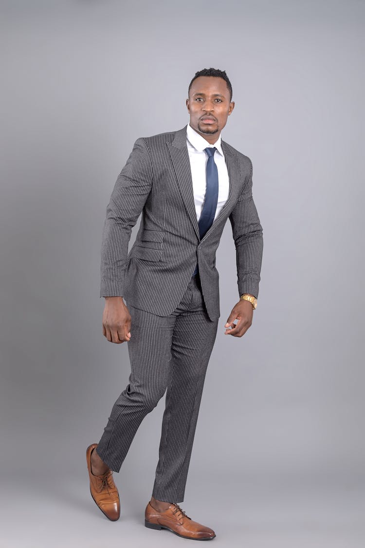 Good Looking Man Posing In Gray Suit