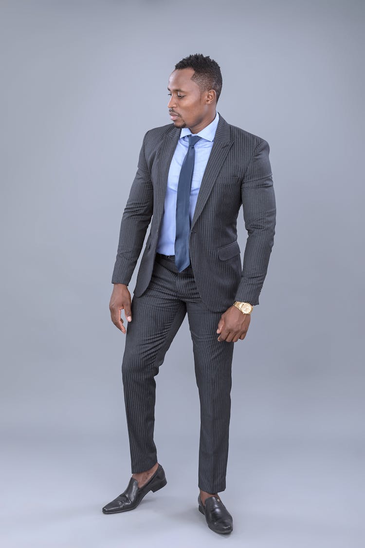 Handsome Man Posing In Gray Corporate Suit