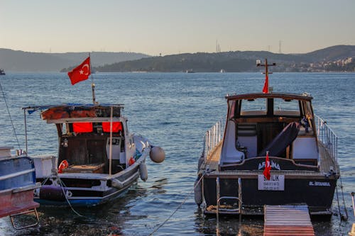 Free Two Small Fishing Boats on Dock Stock Photo