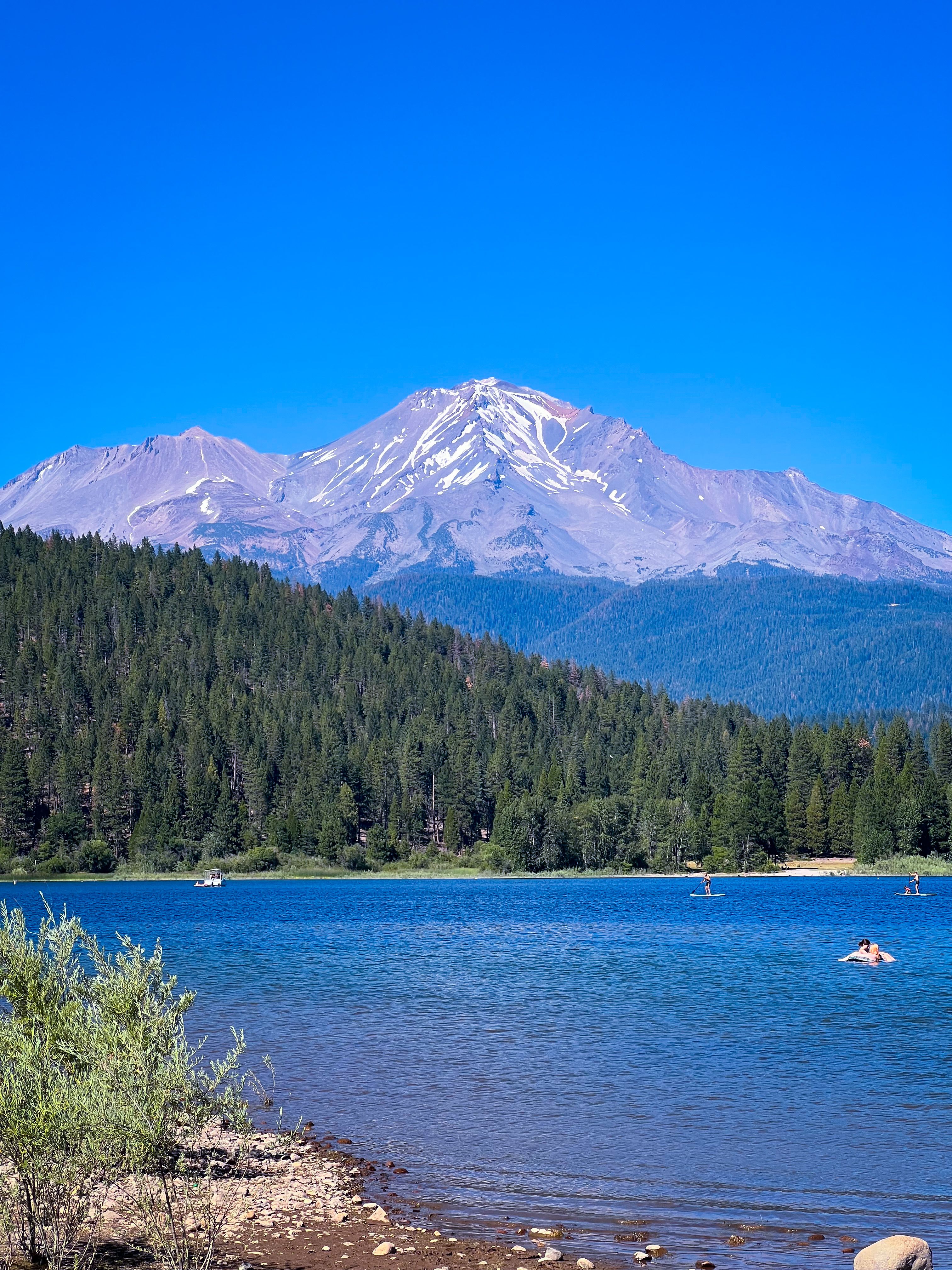 Mount Shasta rising over the blue water of Lake Siskiyou