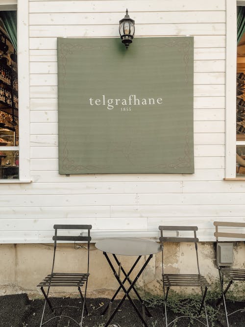 Table and Chairs Outside a Cafe