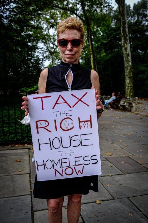 Elderly Woman with Banner