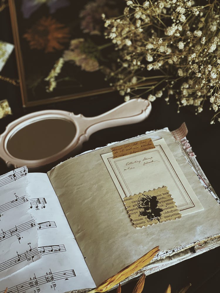 Vintage Vanity Mirror With Open Old Music Book On Table