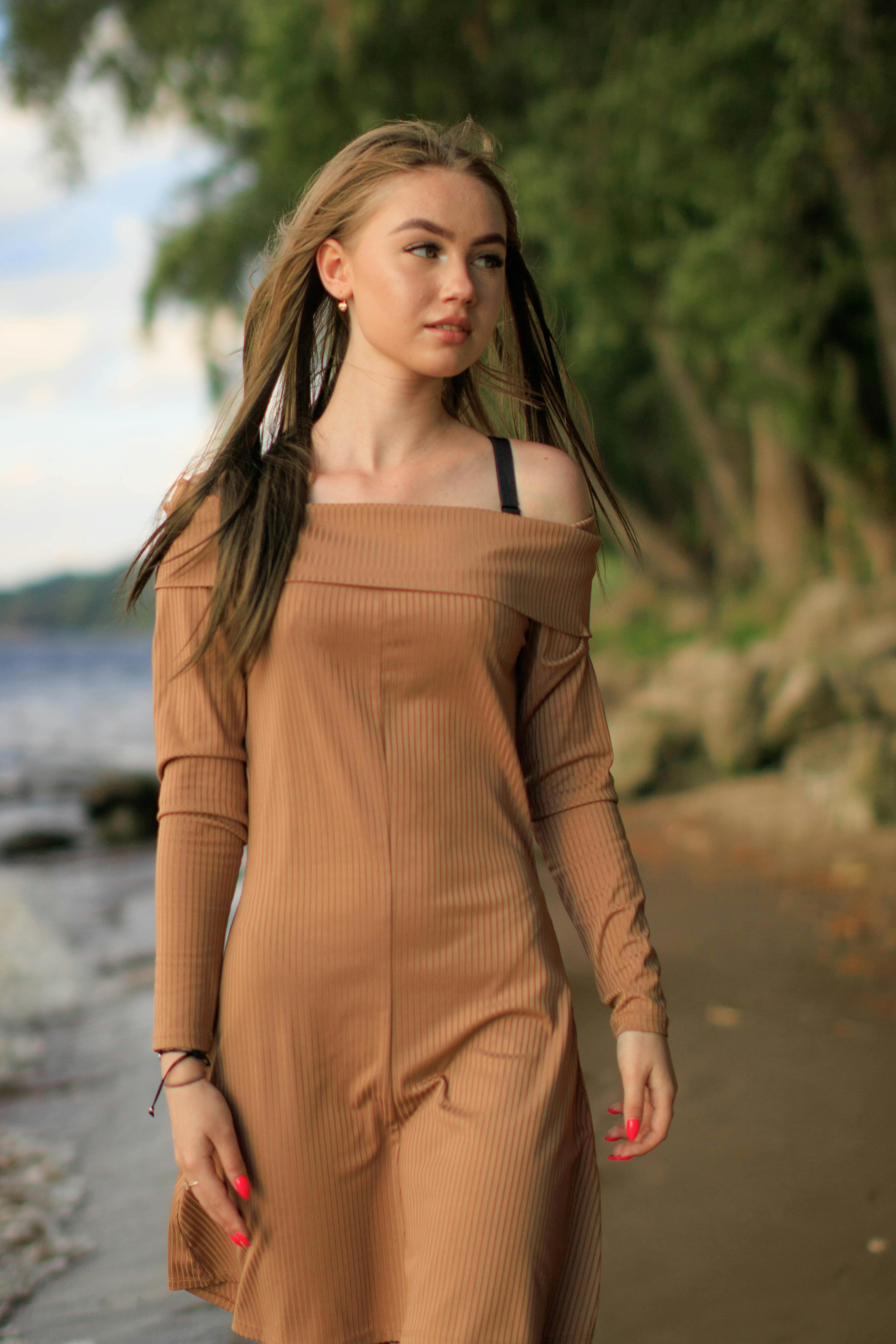 Woman in Brown Long Sleeve Dress · Free Stock Photo