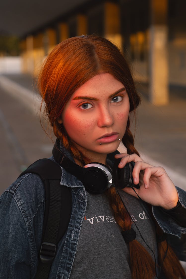 Portrait Of A Young Woman With Braids And Headphones