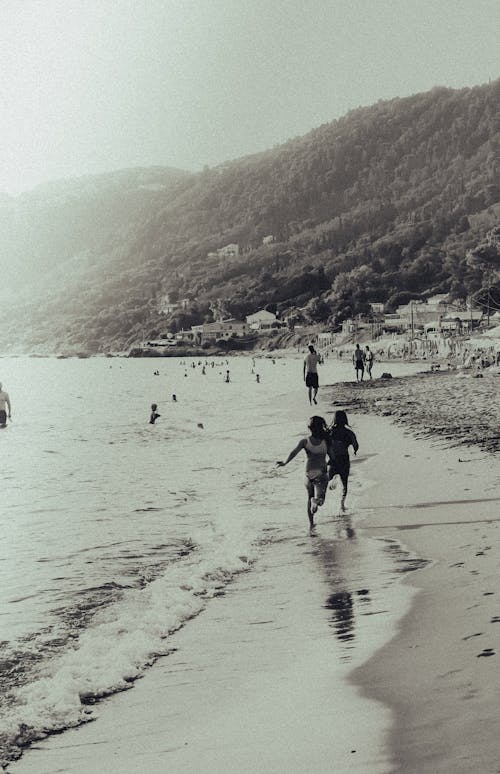 People Walking on the  Beach