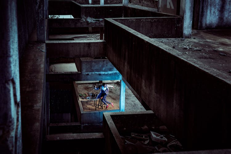 Man Jumping On Ground Floor Inside Abandoned House