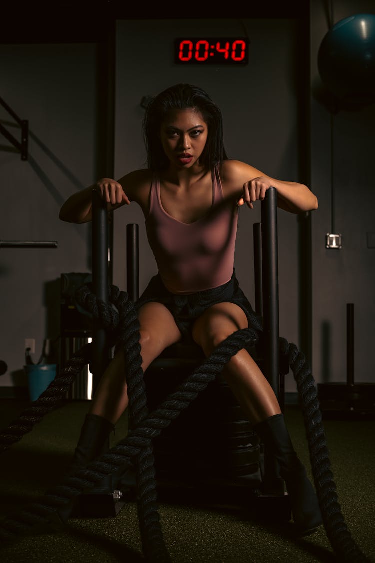 A Woman Sitting In The Gym