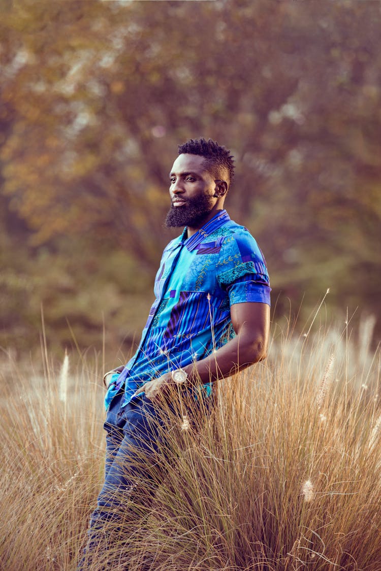 Man In A Blue Shirt On A Field 