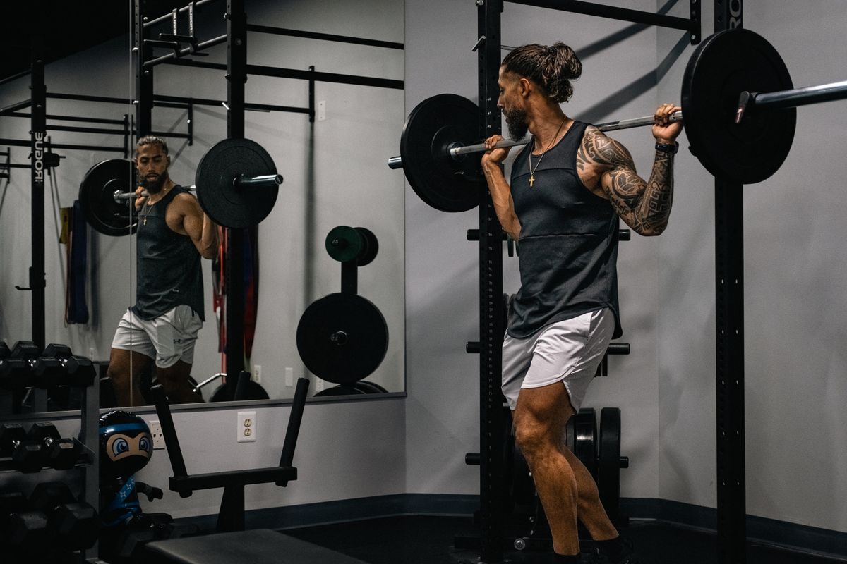 Beginner gym workout plan: what to do in your first 12 weeks | the gym pro Man Training With Weights In A Gym