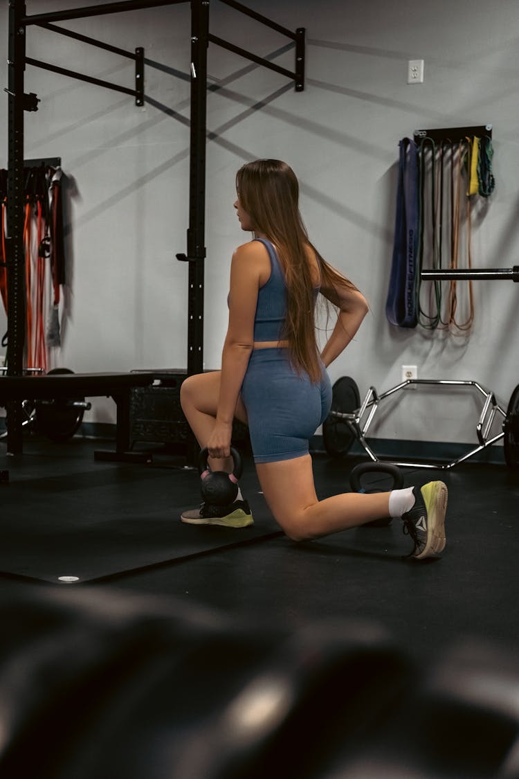 A Woman Doing Lunges 